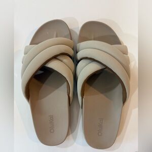 OluKai Women's Crisscross Slide Sandal in Taupe Beige